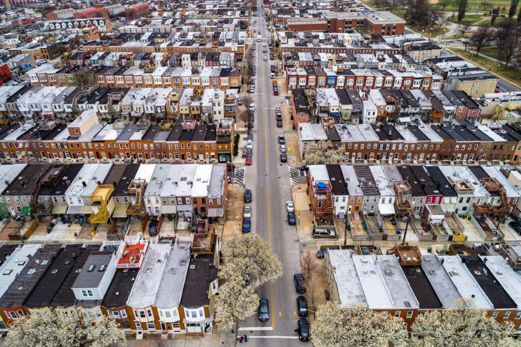 Aerial view of Baltimore City streets and rowhomes.