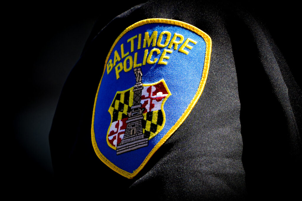 Closeup of a Baltimore Police patch on a uniform sleeve.